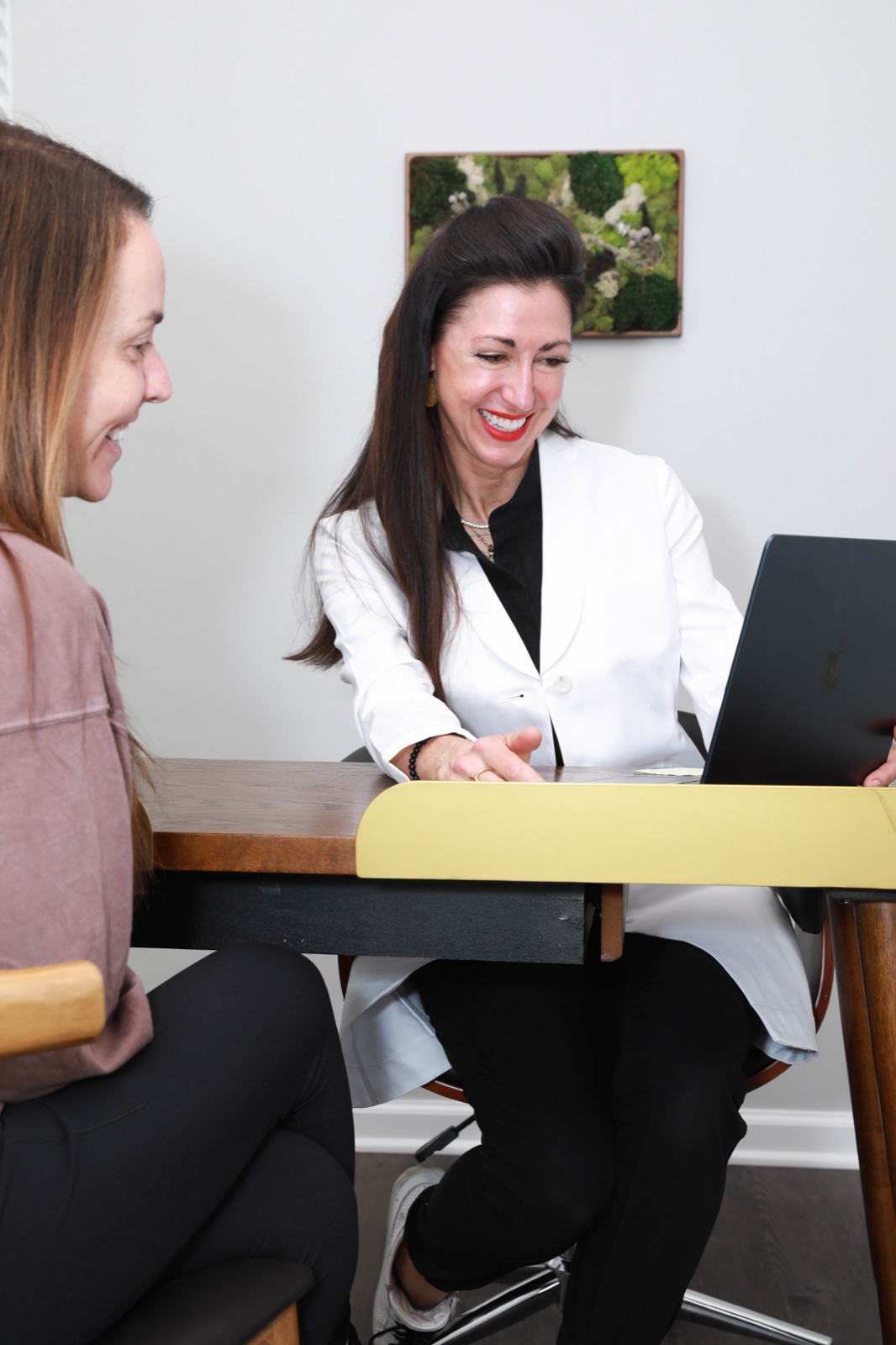Lauren Riley with a patient during an aesthetic consultation
